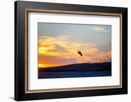 USA, California, Rio Vista, Sacramento River Delta. Kiteboarder catching air at sunset.-Merrill Images-Framed Photographic Print