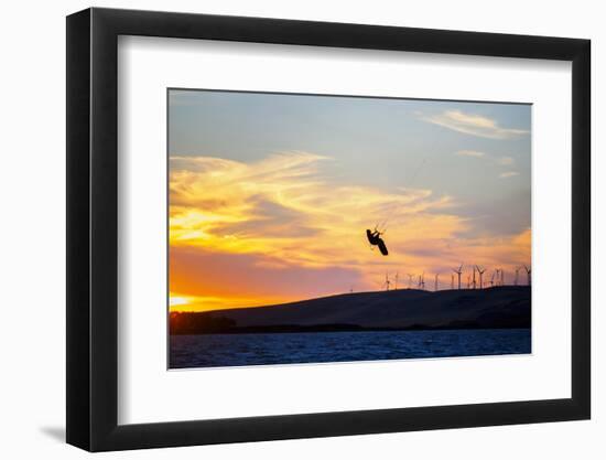 USA, California, Rio Vista, Sacramento River Delta. Kiteboarder catching air at sunset.-Merrill Images-Framed Photographic Print