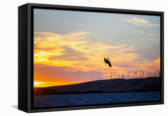 USA, California, Rio Vista, Sacramento River Delta. Kiteboarder catching air at sunset.-Merrill Images-Framed Premier Image Canvas