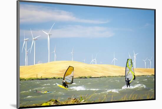 Usa, California, Rio Vista, Sacramento River Delta. Sailboarders with wind turbines.-Merrill Images-Mounted Photographic Print