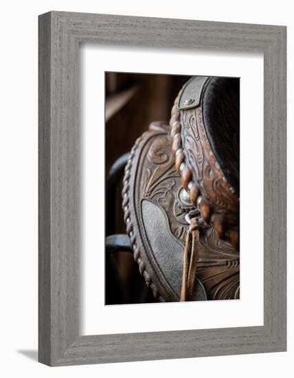 USA, Colorado, Custer County, Westcliffe. Tack room. Tooled leather western saddle.-Cindy Miller Hopkins-Framed Photographic Print