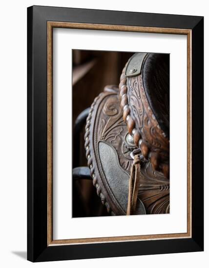 USA, Colorado, Custer County, Westcliffe. Tack room. Tooled leather western saddle.-Cindy Miller Hopkins-Framed Photographic Print