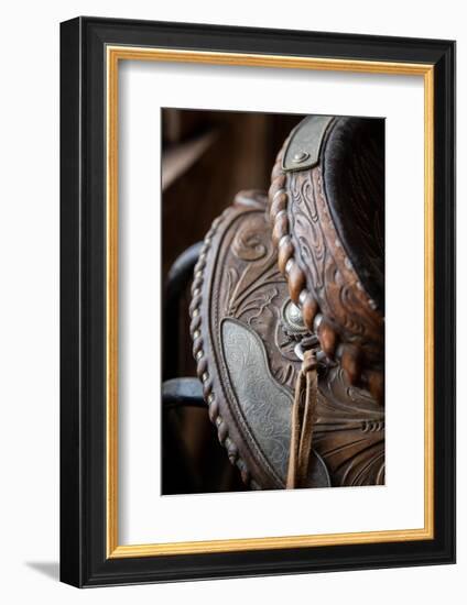 USA, Colorado, Custer County, Westcliffe. Tack room. Tooled leather western saddle.-Cindy Miller Hopkins-Framed Photographic Print