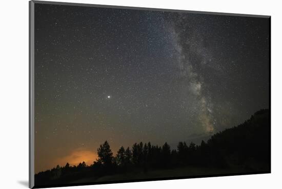 USA, Colorado, Eleven Mile Canyon. The Milky Way galaxy and forest silhouette at night.-Jaynes Gallery-Mounted Photographic Print