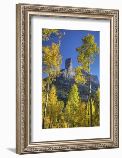 USA, Colorado, San Juan Mountains. Aspen trees frame Chimney Rock formation.-Jaynes Gallery-Framed Photographic Print