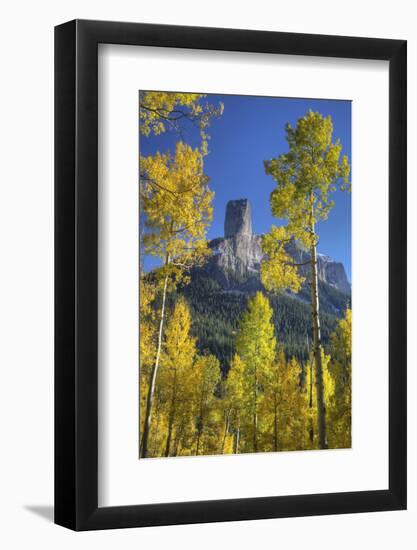 USA, Colorado, San Juan Mountains. Aspen trees frame Chimney Rock formation.-Jaynes Gallery-Framed Photographic Print