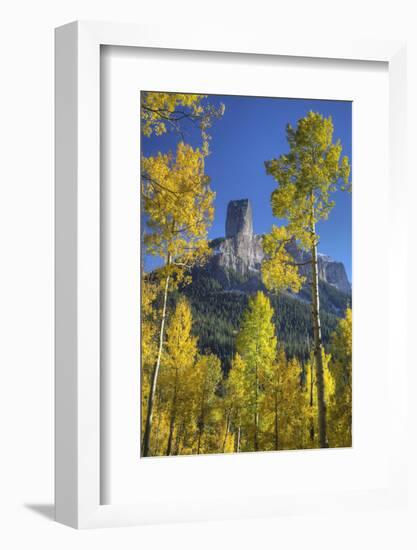 USA, Colorado, San Juan Mountains. Aspen trees frame Chimney Rock formation.-Jaynes Gallery-Framed Photographic Print