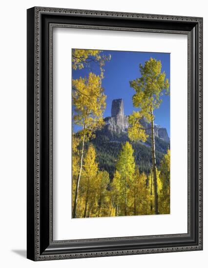 USA, Colorado, San Juan Mountains. Aspen trees frame Chimney Rock formation.-Jaynes Gallery-Framed Photographic Print