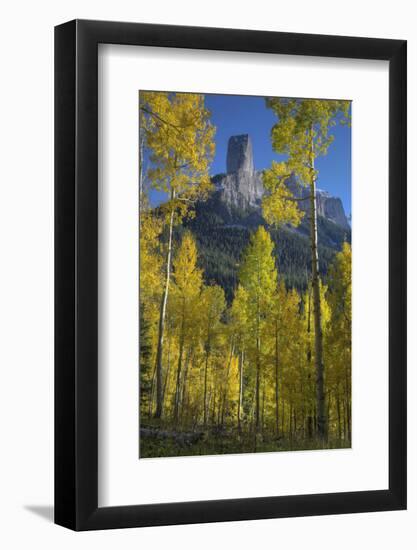 USA, Colorado, San Juan Mountains. Autumn aspen trees frame Chimney Rock.-Jaynes Gallery-Framed Photographic Print