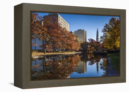 USA, Connecticut, Hartford, Bushnell Park, reflection of office buildings and Travelers Tower-Walter Bibikow-Framed Premier Image Canvas