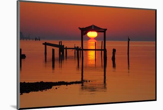 USA, Florida, Apalachicola, Sunrise at an old boat house at Apalachicola Bay.-Joanne Wells-Mounted Photographic Print