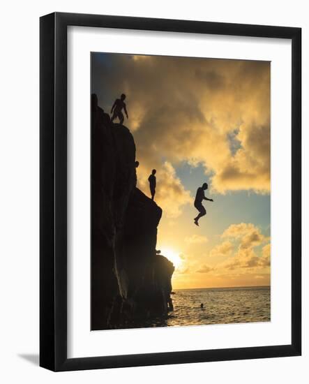 USA, Hawaii, Oahu,  North Shore, Waimea Bay, Divers Jumping Off Cliff-Michele Falzone-Framed Photographic Print