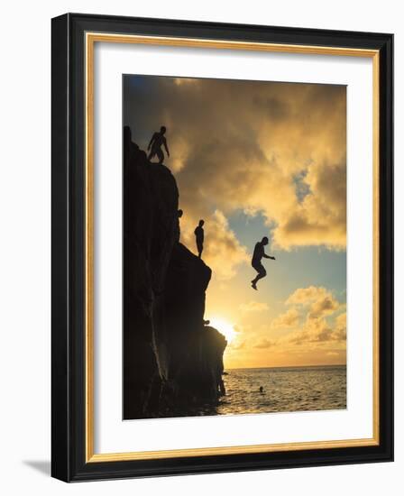 USA, Hawaii, Oahu,  North Shore, Waimea Bay, Divers Jumping Off Cliff-Michele Falzone-Framed Photographic Print