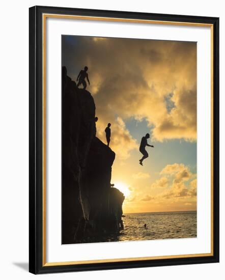 USA, Hawaii, Oahu,  North Shore, Waimea Bay, Divers Jumping Off Cliff-Michele Falzone-Framed Photographic Print