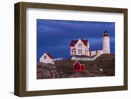 USA, Maine, York Beach, Nubble Light Lighthouse with Christmas decorations at dusk-Walter Bibikow-Framed Photographic Print