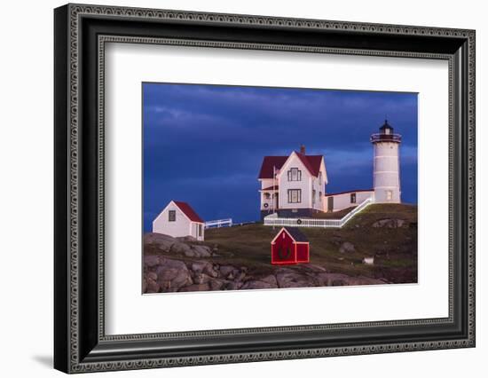 USA, Maine, York Beach, Nubble Light Lighthouse with Christmas decorations at dusk-Walter Bibikow-Framed Photographic Print