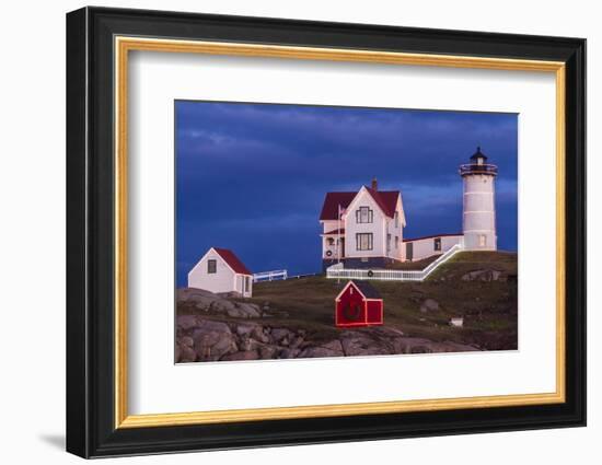 USA, Maine, York Beach, Nubble Light Lighthouse with Christmas decorations at dusk-Walter Bibikow-Framed Photographic Print