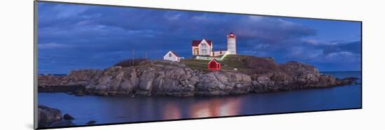 USA, Maine, York Beach, Nubble Light Lighthouse with Christmas decorations, dusk-Walter Bibikw-Mounted Photographic Print