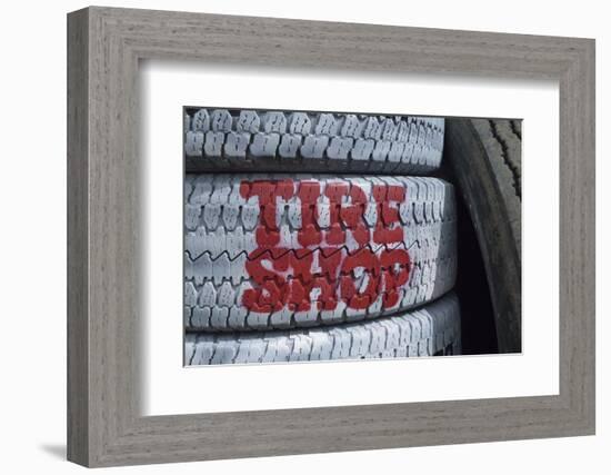 USA, Nevada. Beatty, tire shop sign painted on old tires-Kevin Oke-Framed Photographic Print