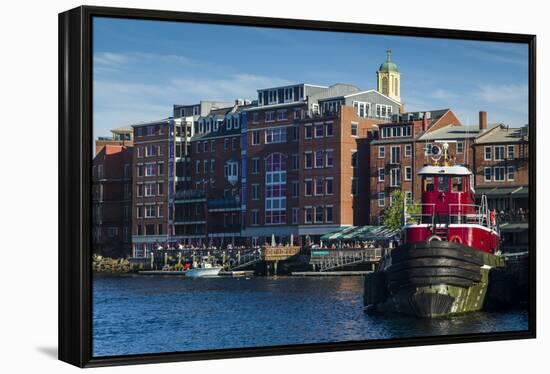 USA, New Hampshire, Portsmouth, waterfront buildings with tugboat-Walter Bibikow-Framed Premier Image Canvas