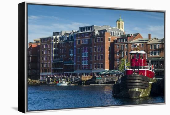 USA, New Hampshire, Portsmouth, waterfront buildings with tugboat-Walter Bibikow-Framed Premier Image Canvas