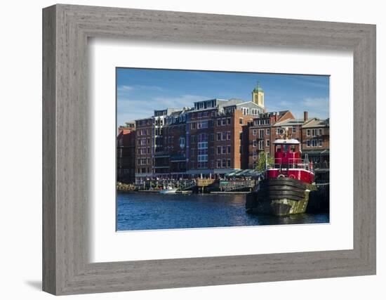 USA, New Hampshire, Portsmouth, waterfront buildings with tugboat-Walter Bibikow-Framed Photographic Print