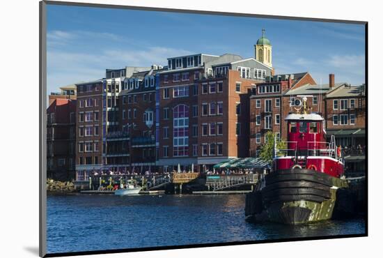 USA, New Hampshire, Portsmouth, waterfront buildings with tugboat-Walter Bibikow-Mounted Photographic Print