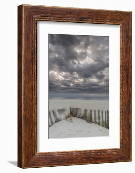 USA, New Jersey, Cape May National Seashore. Beach fence and stormy sunrise.-Jaynes Gallery-Framed Photographic Print