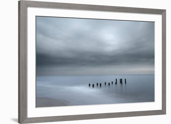 USA, New Jersey, Cape May National Seashore. Beach pilings on stormy sunrise.-Jaynes Gallery-Framed Photographic Print