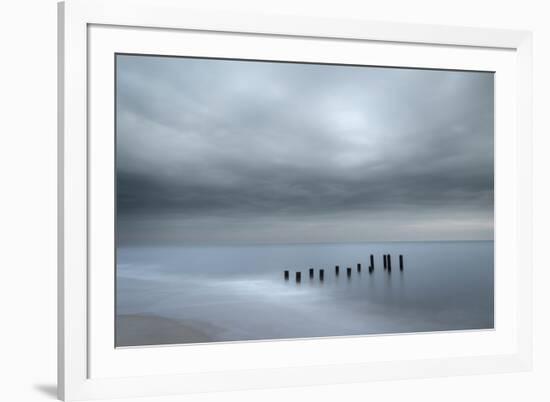 USA, New Jersey, Cape May National Seashore. Beach pilings on stormy sunrise.-Jaynes Gallery-Framed Photographic Print