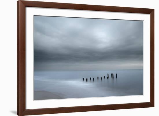 USA, New Jersey, Cape May National Seashore. Beach pilings on stormy sunrise.-Jaynes Gallery-Framed Photographic Print