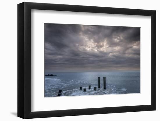 USA, New Jersey, Cape May National Seashore. Beach pilings on stormy sunrise.-Jaynes Gallery-Framed Photographic Print