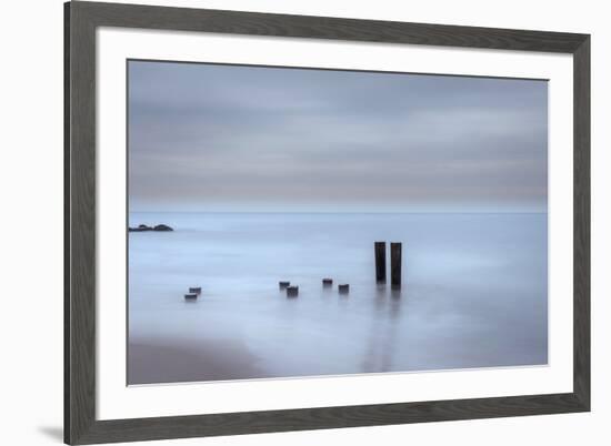 USA, New Jersey, Cape May National Seashore. Beach pilings on stormy sunrise.-Jaynes Gallery-Framed Premium Photographic Print