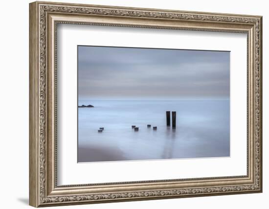 USA, New Jersey, Cape May National Seashore. Beach pilings on stormy sunrise.-Jaynes Gallery-Framed Photographic Print