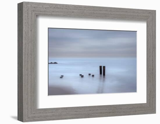 USA, New Jersey, Cape May National Seashore. Beach pilings on stormy sunrise.-Jaynes Gallery-Framed Photographic Print