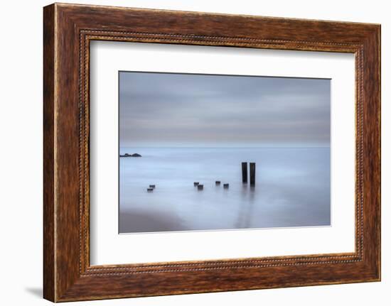 USA, New Jersey, Cape May National Seashore. Beach pilings on stormy sunrise.-Jaynes Gallery-Framed Photographic Print