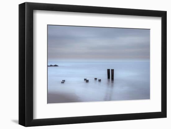 USA, New Jersey, Cape May National Seashore. Beach pilings on stormy sunrise.-Jaynes Gallery-Framed Photographic Print