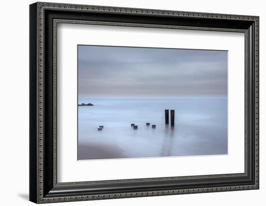 USA, New Jersey, Cape May National Seashore. Beach pilings on stormy sunrise.-Jaynes Gallery-Framed Photographic Print