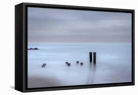 USA, New Jersey, Cape May National Seashore. Beach pilings on stormy sunrise.-Jaynes Gallery-Framed Premier Image Canvas