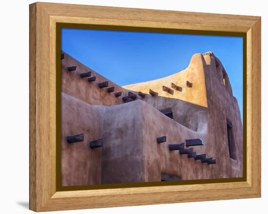 USA, New Mexico, Sant Fe, Adobe structure with protruding vigas and Snow-Terry Eggers-Framed Premier Image Canvas