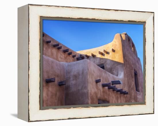 USA, New Mexico, Sant Fe, Adobe structure with protruding vigas and Snow-Terry Eggers-Framed Premier Image Canvas