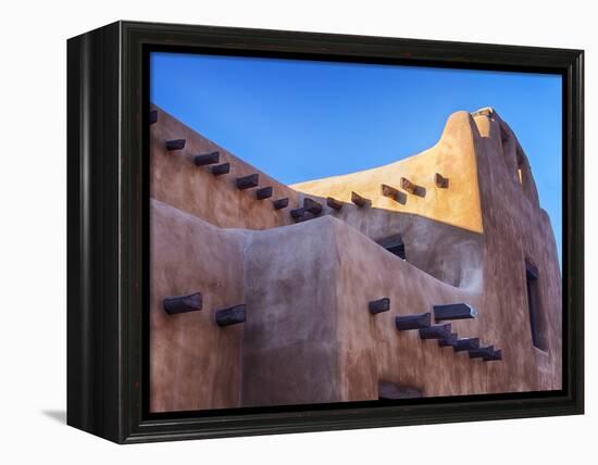 USA, New Mexico, Sant Fe, Adobe structure with protruding vigas and Snow-Terry Eggers-Framed Premier Image Canvas