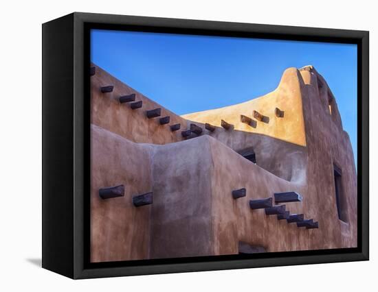 USA, New Mexico, Sant Fe, Adobe structure with protruding vigas and Snow-Terry Eggers-Framed Premier Image Canvas