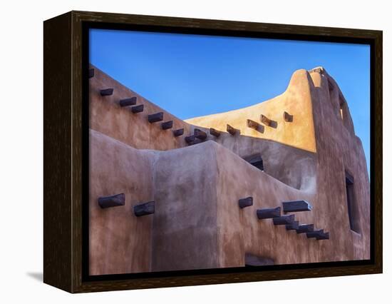 USA, New Mexico, Sant Fe, Adobe structure with protruding vigas and Snow-Terry Eggers-Framed Premier Image Canvas