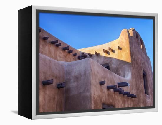 USA, New Mexico, Sant Fe, Adobe structure with protruding vigas and Snow-Terry Eggers-Framed Premier Image Canvas