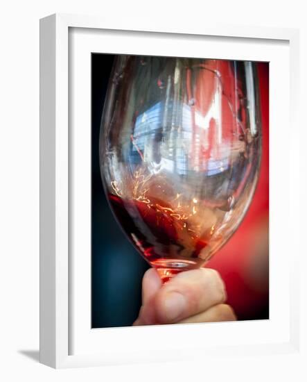 USA, Oregon, Portland. A swirl of red wine in glass reflecting light.-Richard Duval-Framed Photographic Print