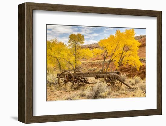 USA, Utah, Capitol Reef National Park. Old wagon and mountain and trees in autumn.-Jaynes Gallery-Framed Photographic Print