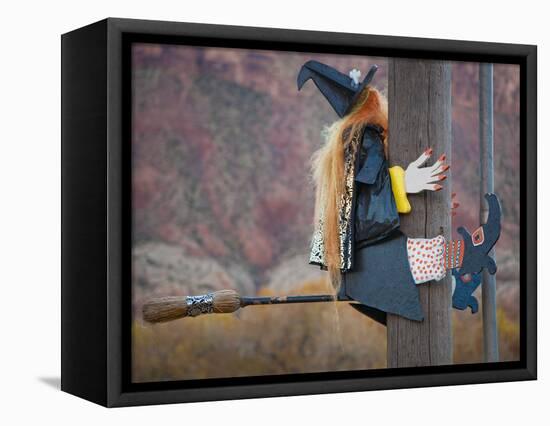 USA, Utah, Moab, Halloween witch on broomstick that crashed into pole.-Merrill Images-Framed Premier Image Canvas