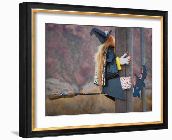 USA, Utah, Moab, Halloween witch on broomstick that crashed into pole.-Merrill Images-Framed Photographic Print