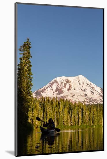 USA, WA. Woman kayaker paddles on calm, scenic Takhlakh Lake with Mt. Adams in the background.-Gary Luhm-Mounted Photographic Print